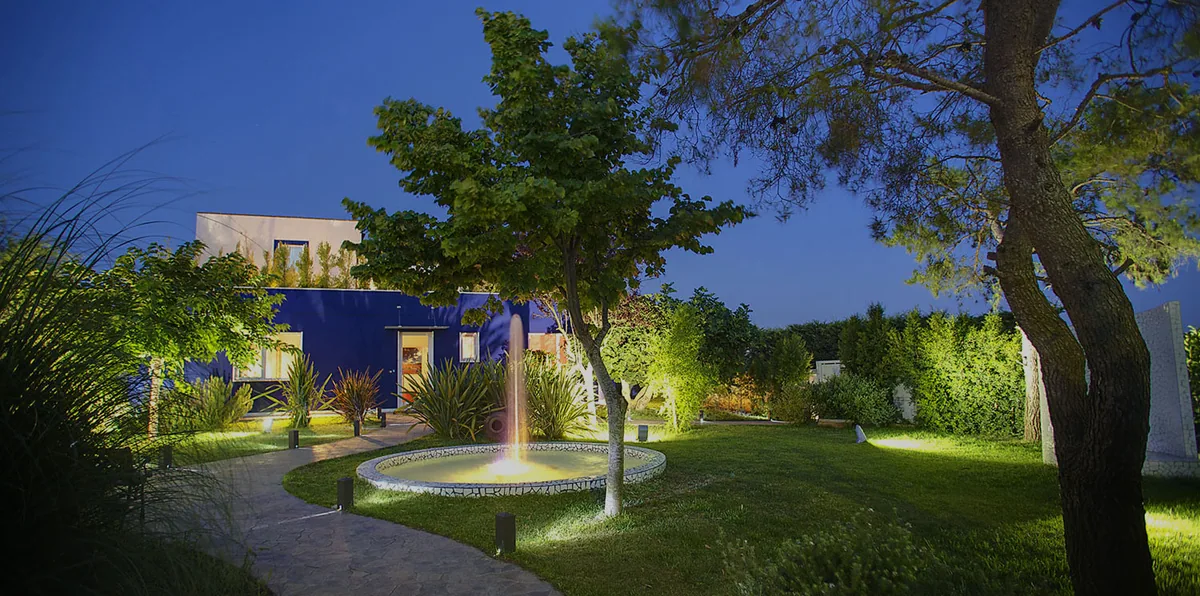 The gardens and fountain of Hotel Intervallo at dusk
